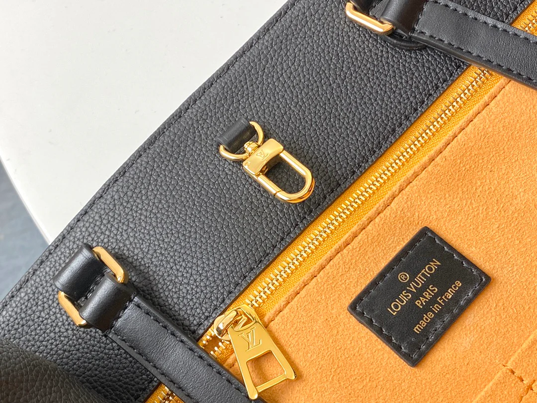 lv-m44925-black embossed-onthego-handbag