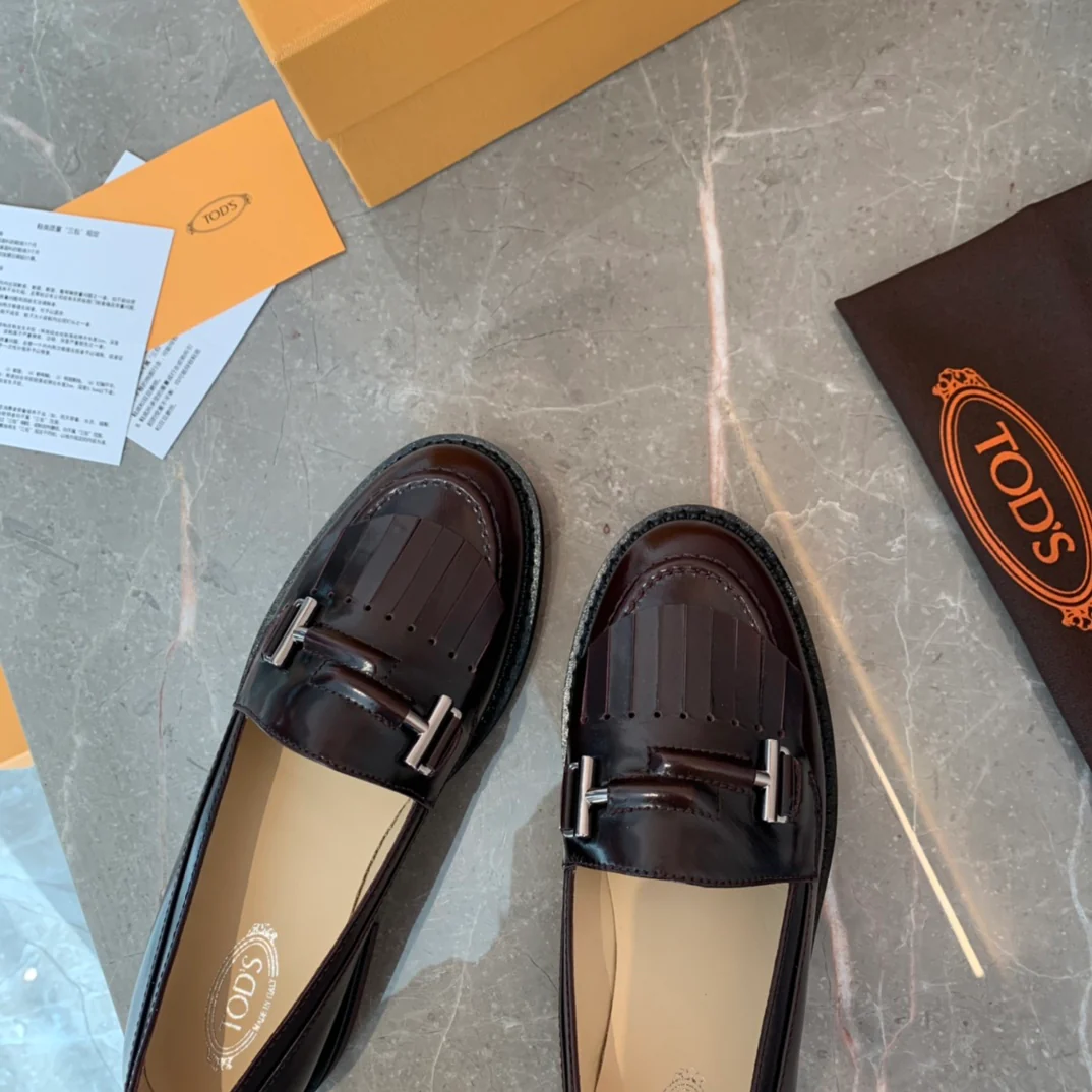 Лоферы Tods Double T с кисточками