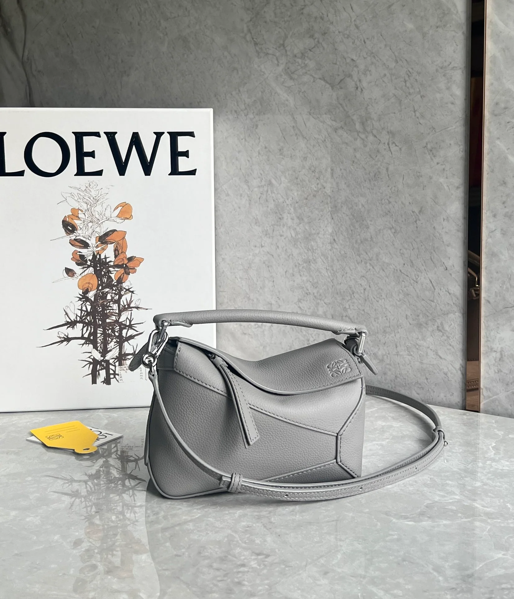 Мини-юбка Loewe Puzzle из кожи серого цвета