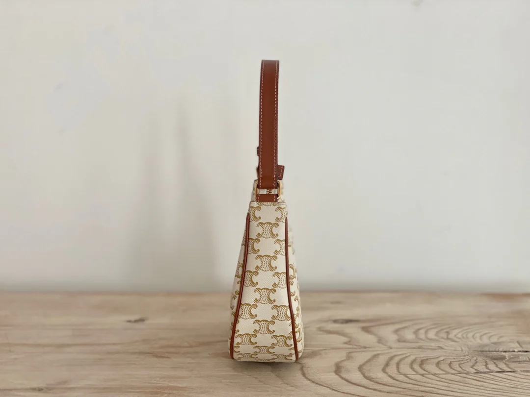 Сумка Ava Triomphe из канваса — белая с монограммой.