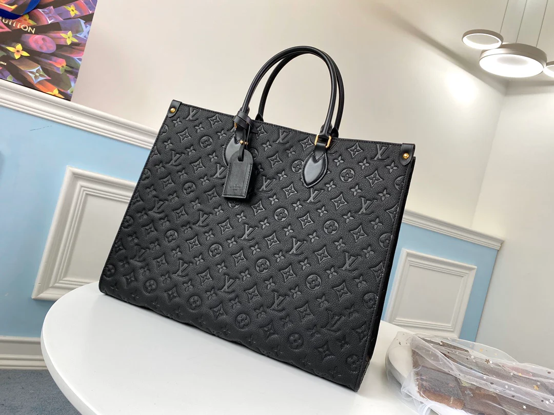 lv-m44925-black embossed-onthego-handbag