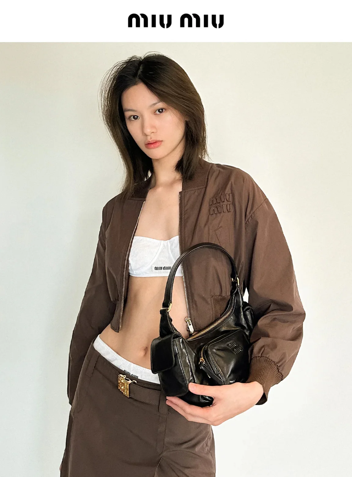 Сумка Miu Miu из кожи наппа с карманами — носите и делитесь с другими.