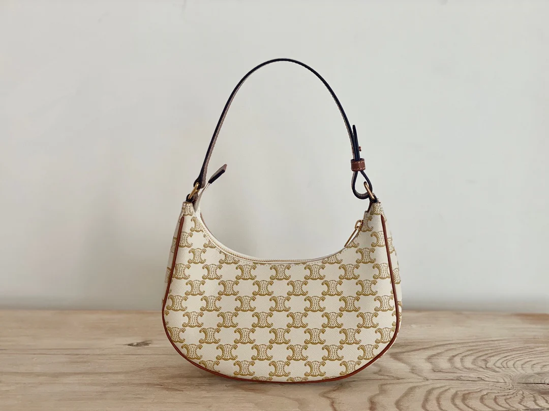 Сумка Ava Triomphe из канваса — белая с монограммой.