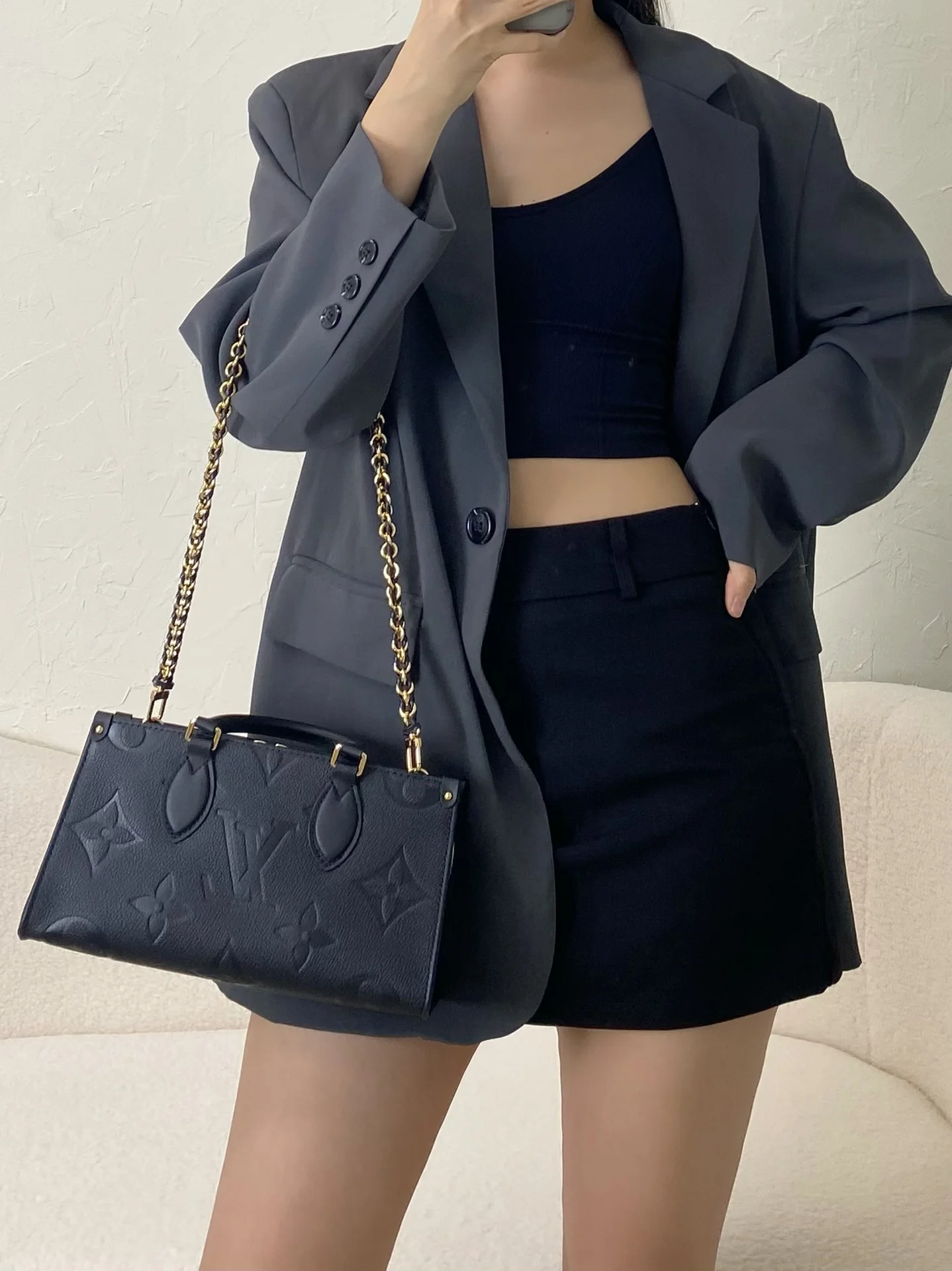 m23640-LV-cabas-onthego-east-west-gold chain embossed monogram-black