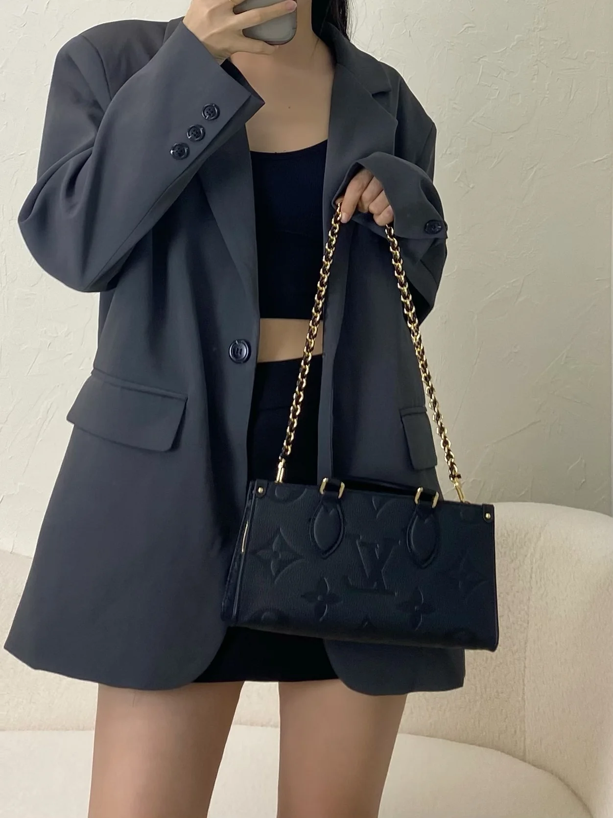 m23640-LV-cabas-onthego-east-west-gold chain embossed monogram-black