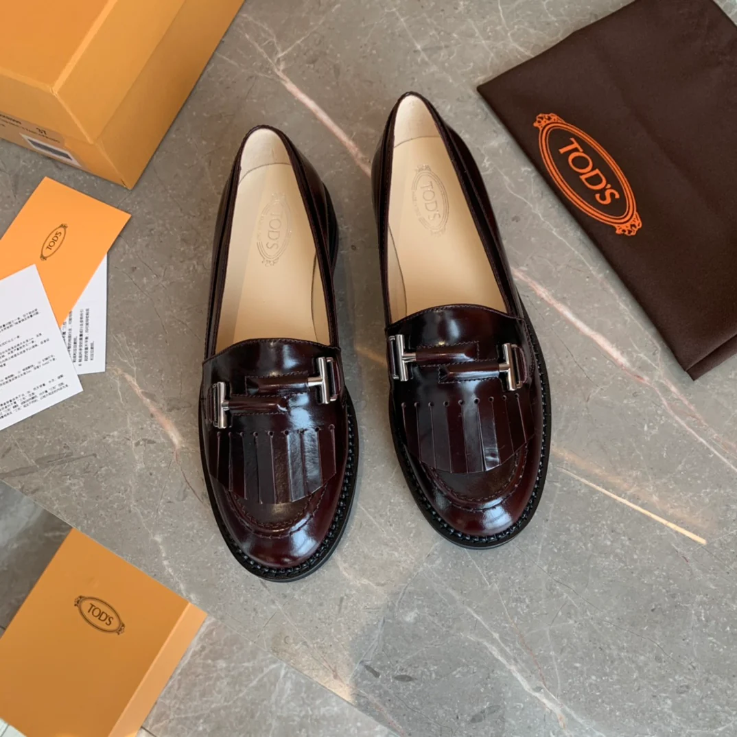 Лоферы Tods Double T с кисточками