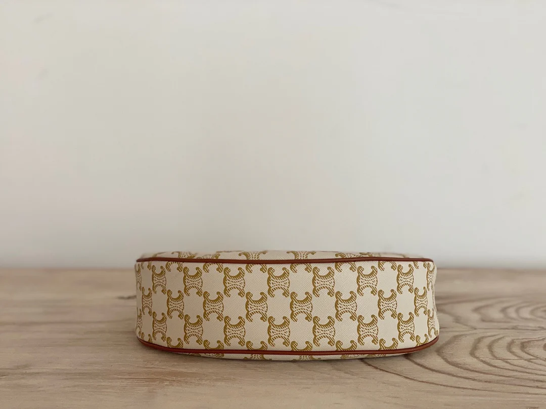 Сумка Ava Triomphe из канваса — белая с монограммой.