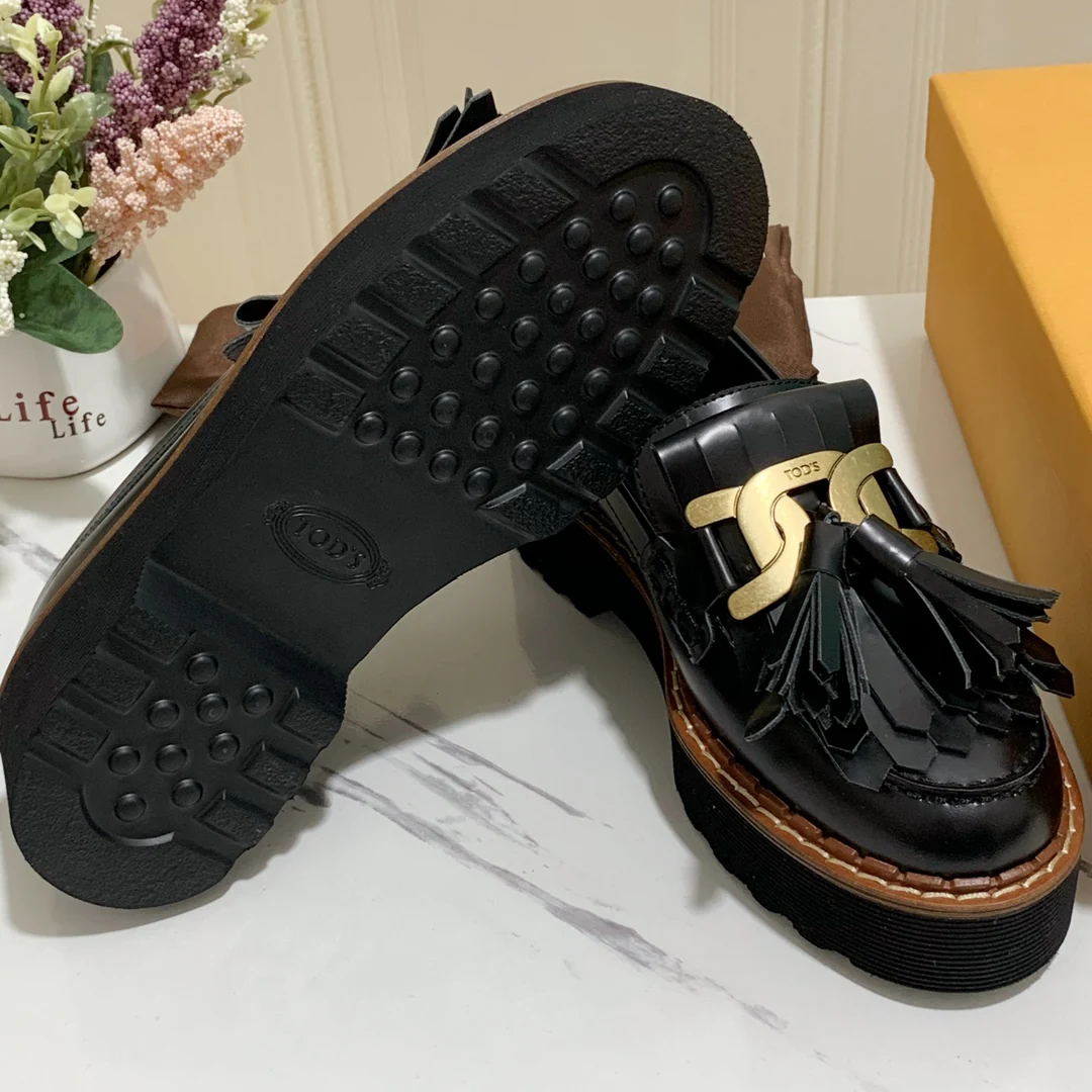 Лоферы на платформе Tods с кисточками