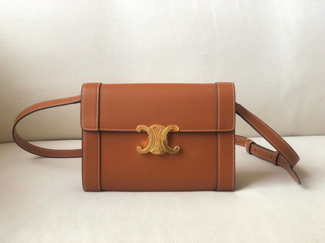 Кожаная сумка Celine Triomphe с ремешком — желто-коричневая.