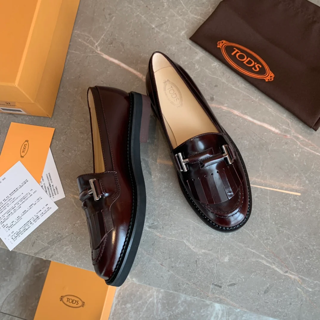 Лоферы Tods Double T с кисточками