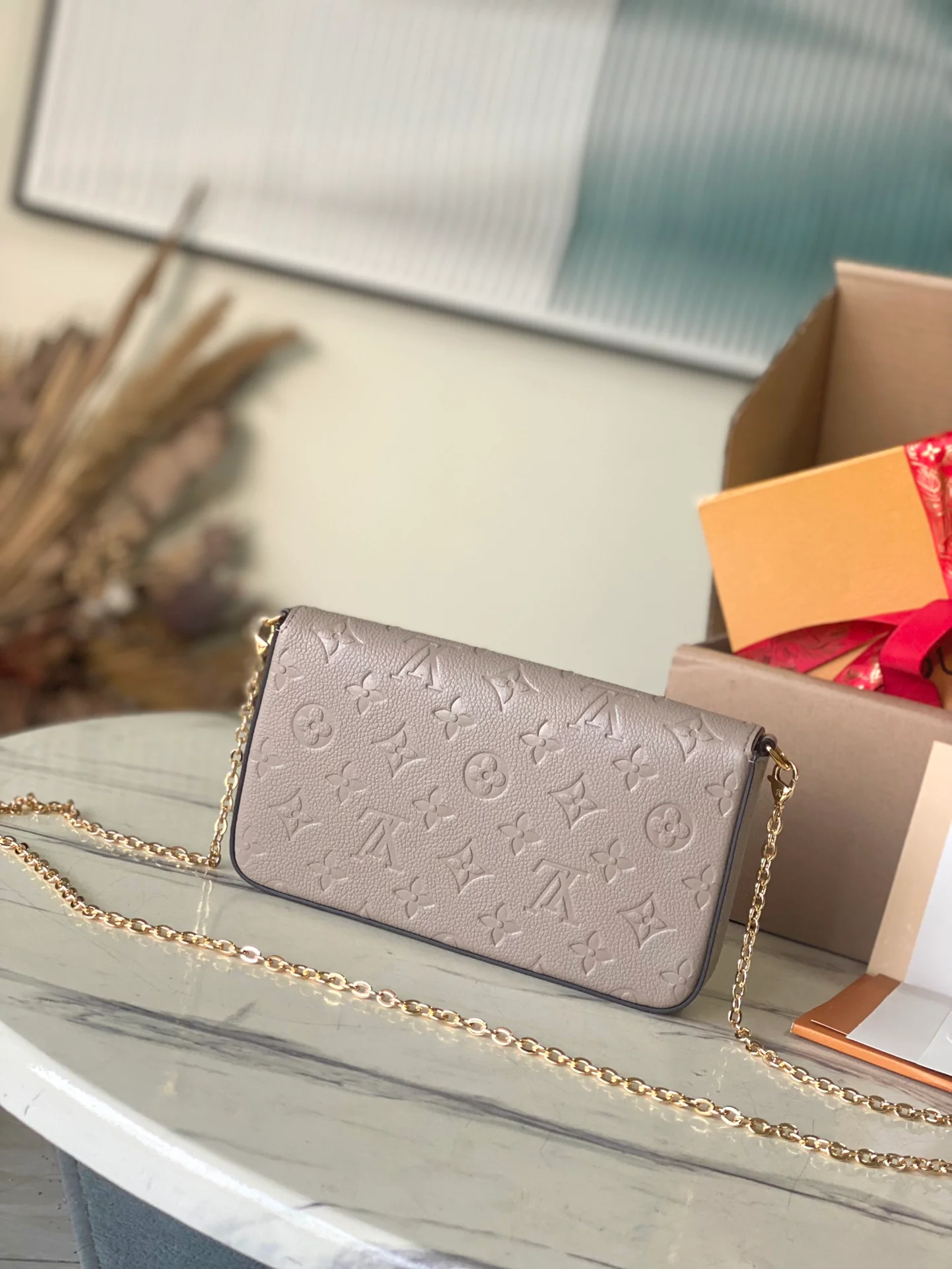 m82609-LV-pochette-felicie-embossed calfskin-milk tea color