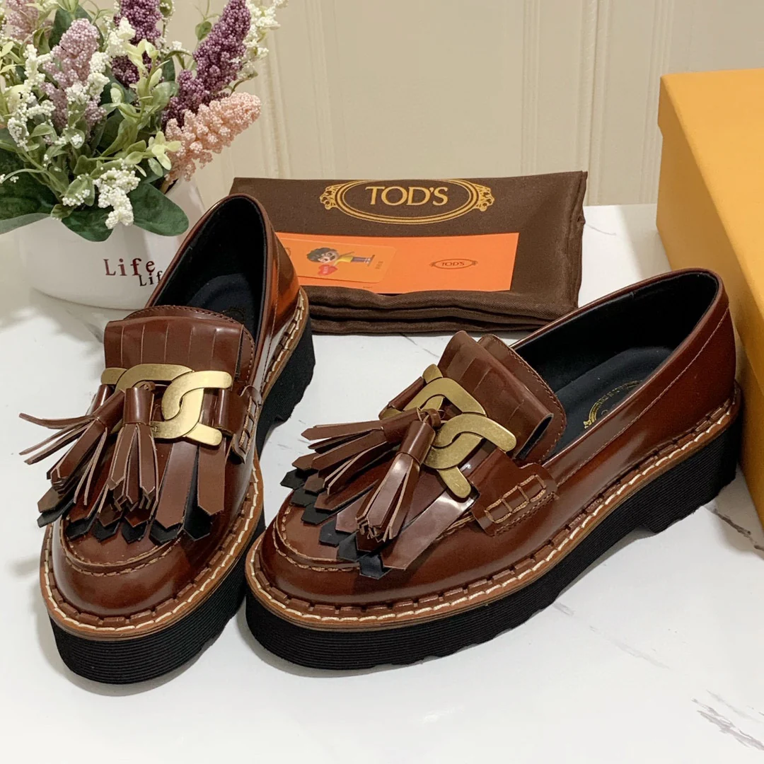 Лоферы на платформе Tods с кисточками