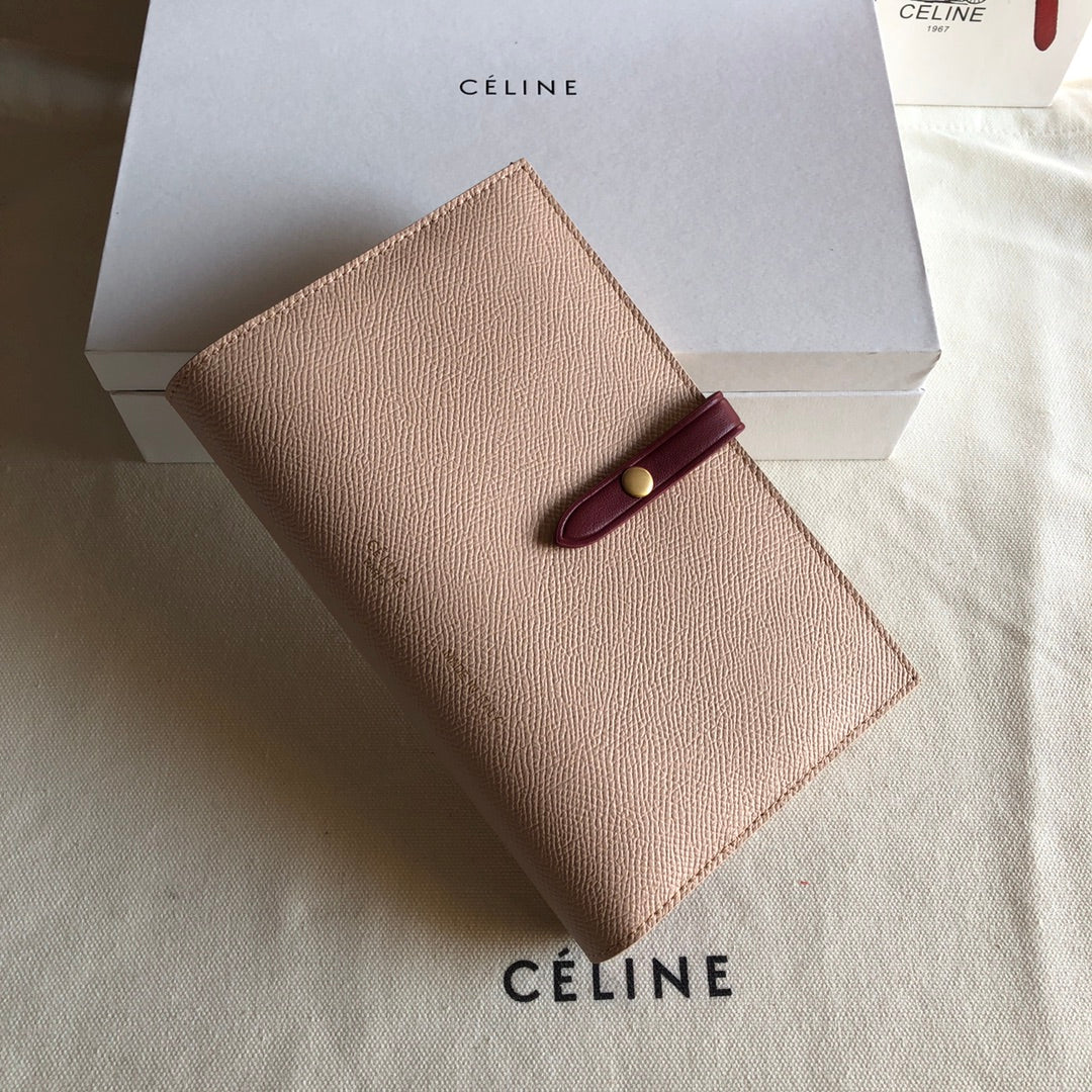 Длинный кошелек Celine — розовый и бордовый — с принтом в виде пальм.