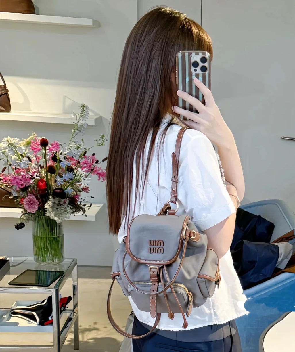 Рюкзак Miu Miu из канваса и кожи, размер S, серый (на фото).