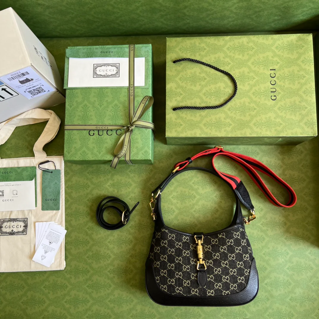 Джинсы Gucci Jackie 1961 из черного денима.