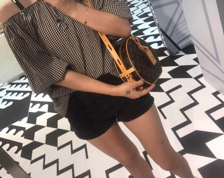 Круглая сумка LV