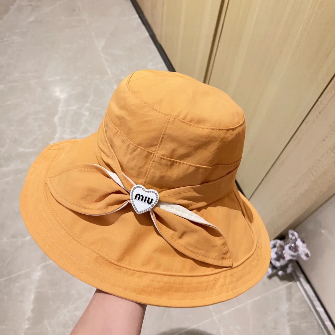 Новая рыбацкая шляпа Miu Miu 2023 с бантом - желтая.
