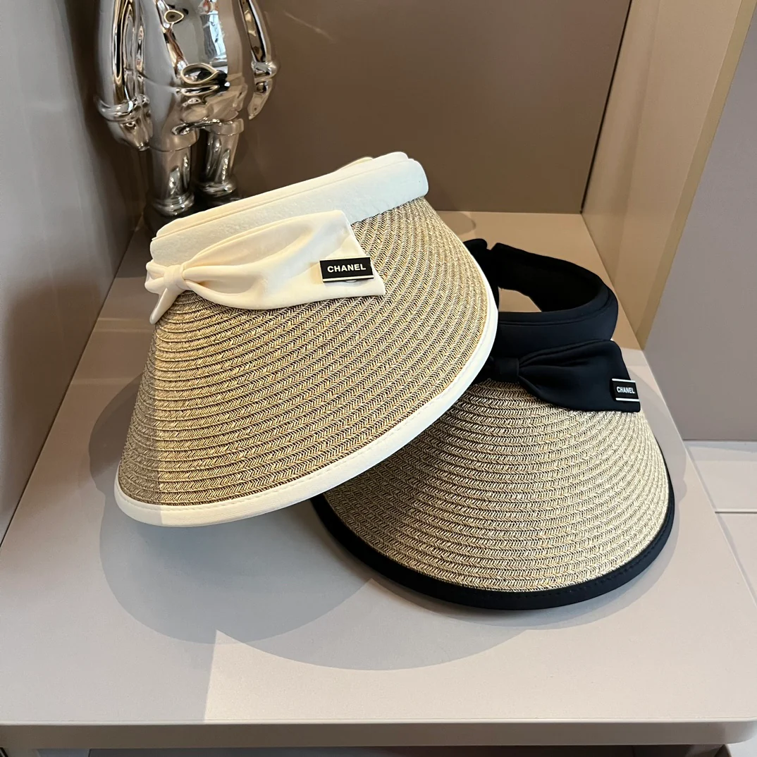 Chanel - Плетеная солнцезащитная шляпа с бантом - черная