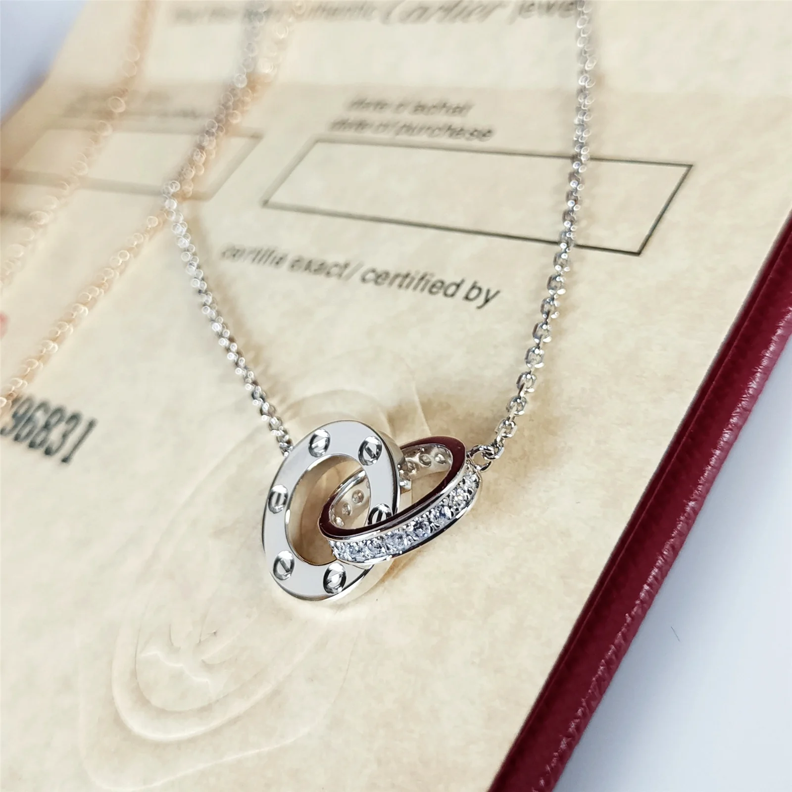 Колье Cartier Love Double Ring с двумя кольцами - половина бриллианта