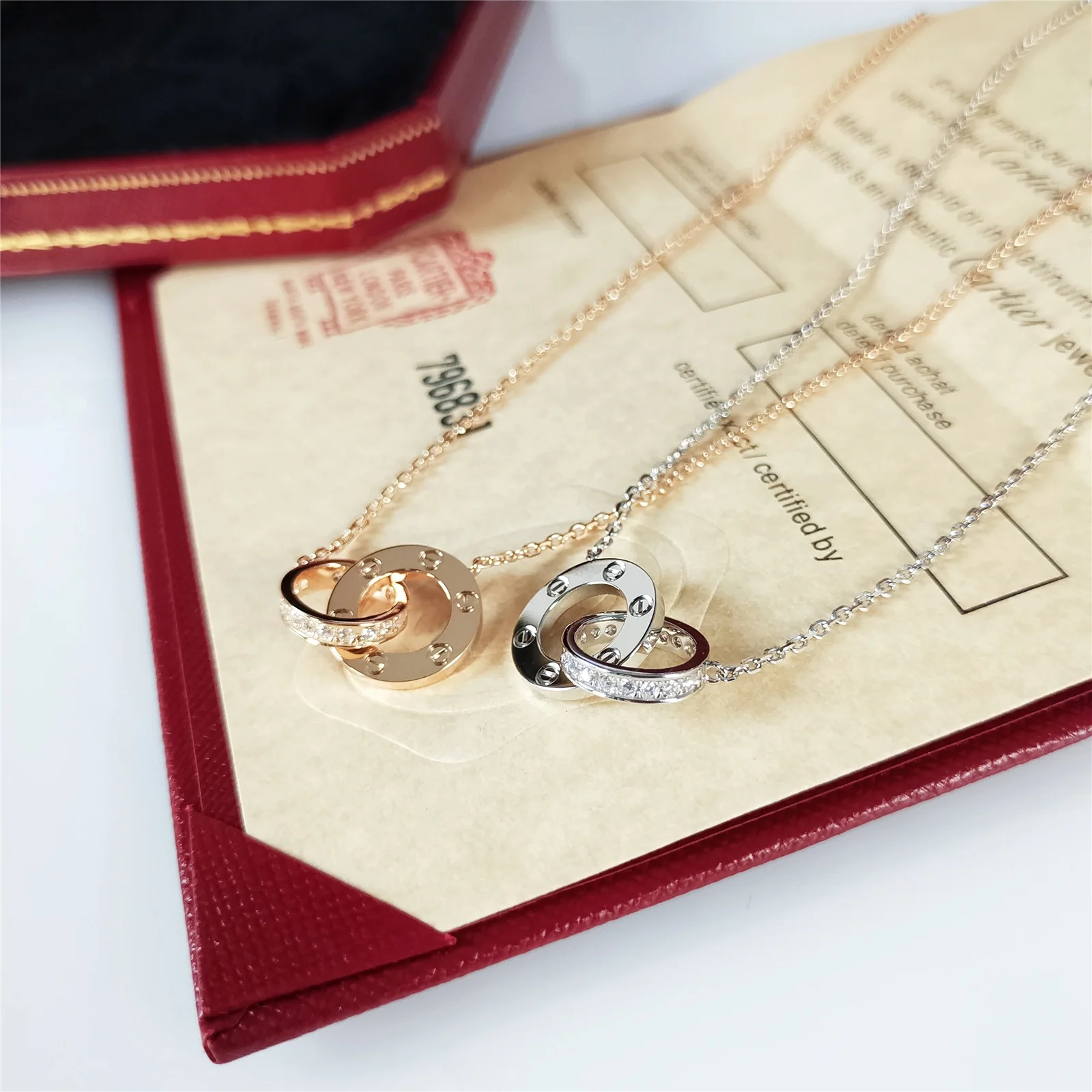 Колье Cartier Love Double Ring с двумя кольцами - половина бриллианта