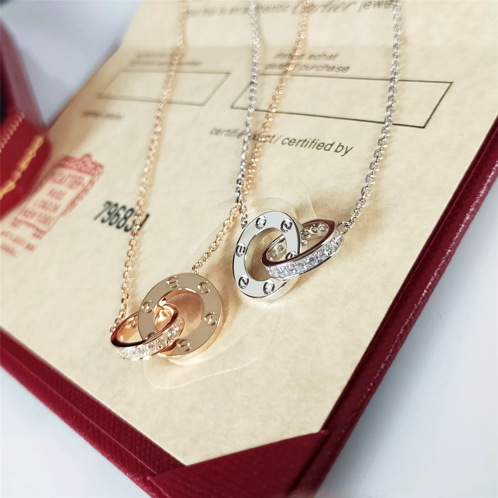 Колье Cartier Love Double Ring с двумя кольцами - половина бриллианта