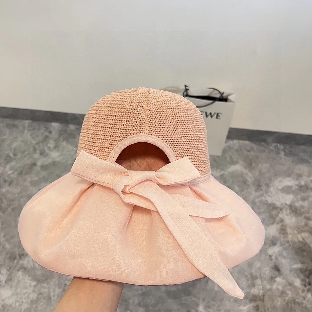 Новая двухслойная плетеная рыбацкая шляпа Chanel из коллекции ?Ранняя весна 2024? — розовая.