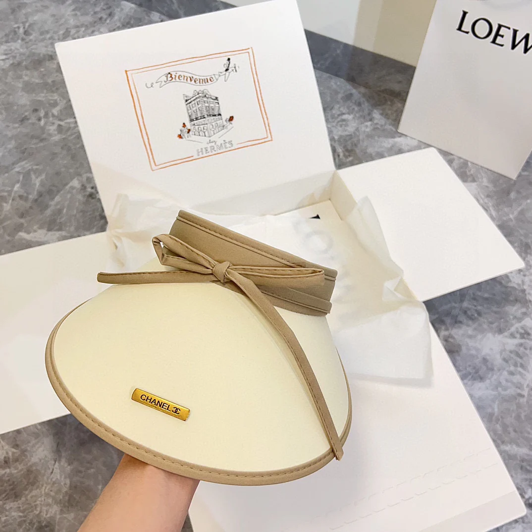 Новая солнцезащитная шляпа Chanel 2024 из ледяного шелка с бантом - абрикосового цвета.