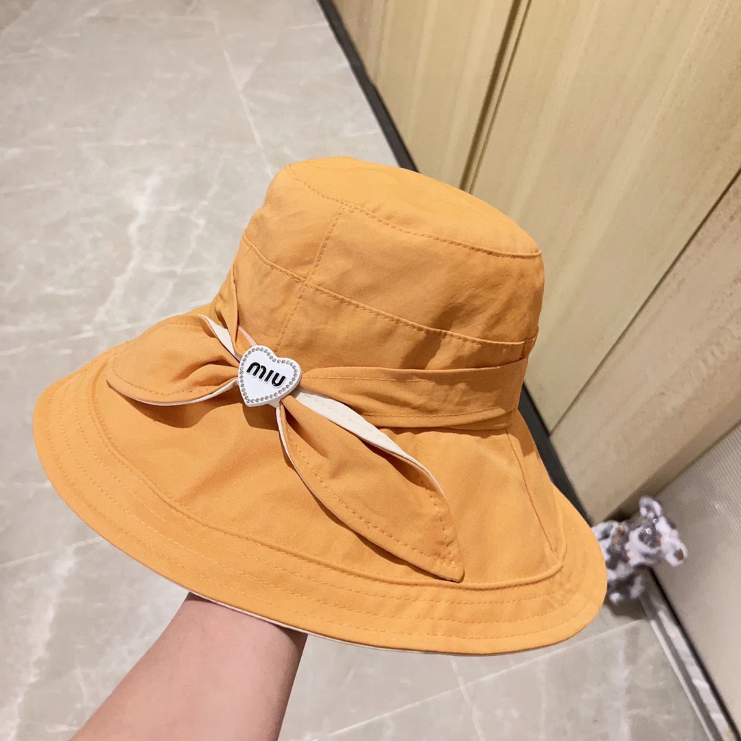 Новая рыбацкая шляпа Miu Miu 2023 с бантом - желтая.