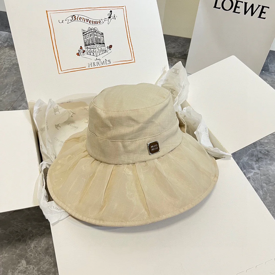Новая шелковая шляпа от солнца Miu Miu 2024 с бантом - абрикосового цвета.