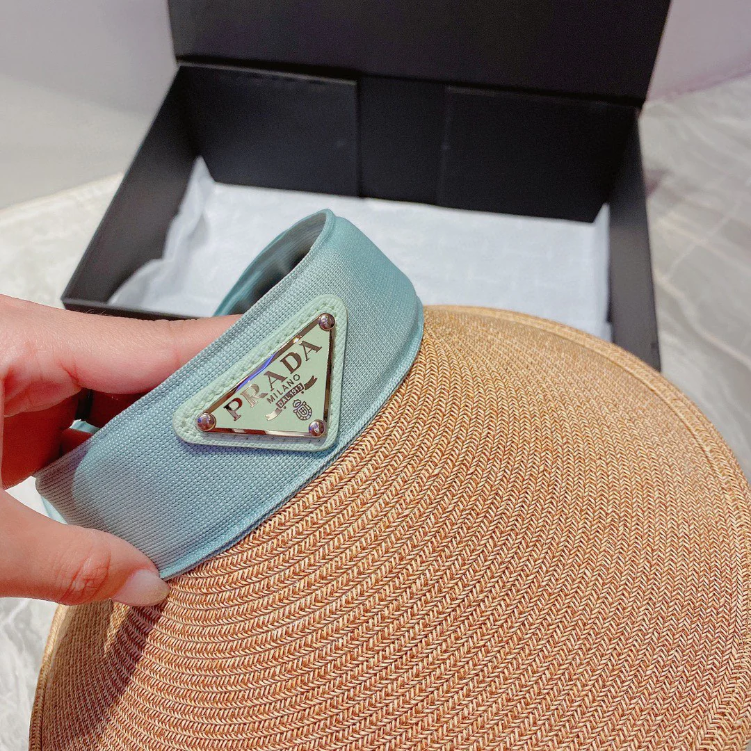 Prada - Классическая солнцезащитная шляпа с треугольным логотипом и лоскутным дизайном