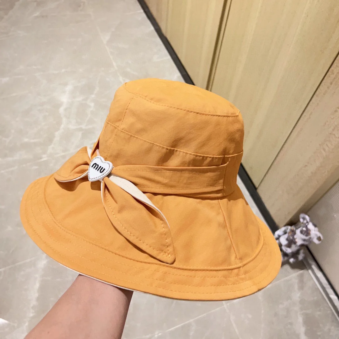 Новая рыбацкая шляпа Miu Miu 2023 с бантом - желтая.