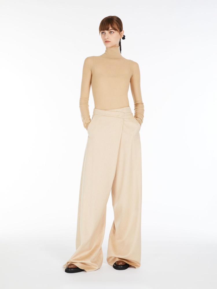 Long, albino camel colour trousers