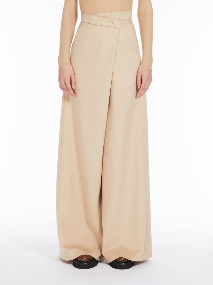 Long, albino camel colour trousers
