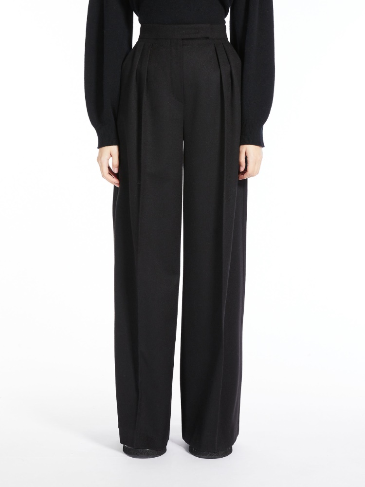 Wide, camel colour trousers