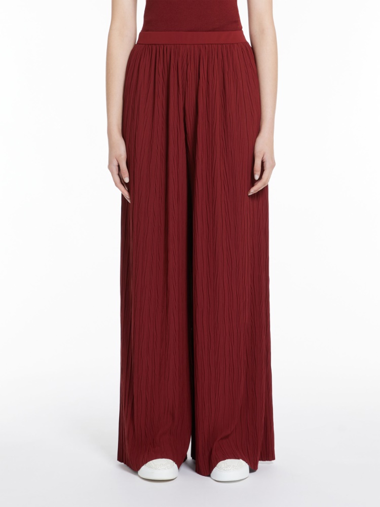 Wide-fit pleated jersey trousers