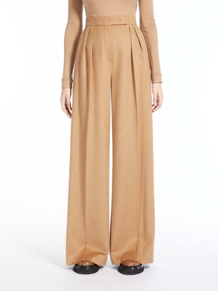 Wide, camel colour trousers