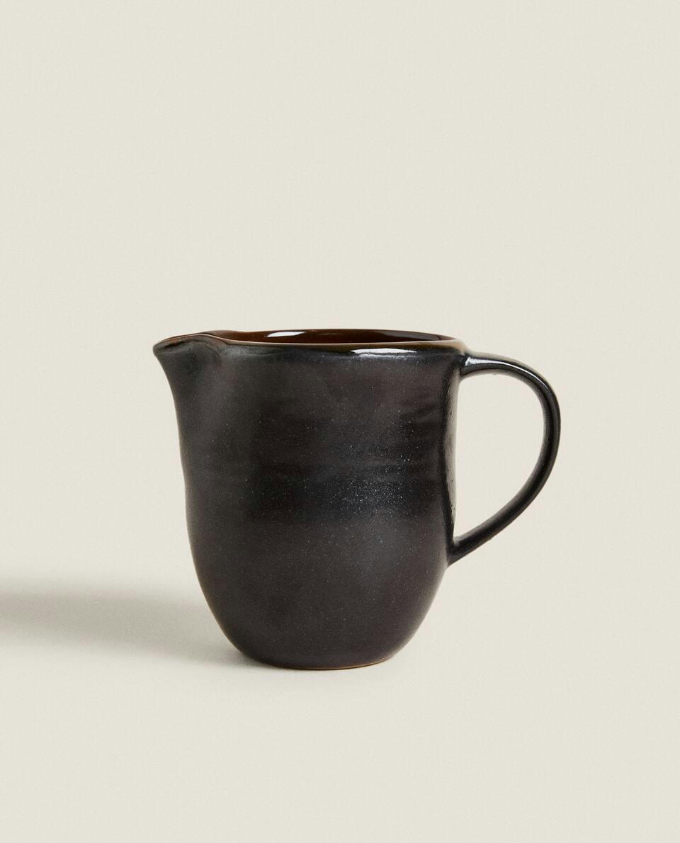 STONEWARE JUG WITH HANDLE