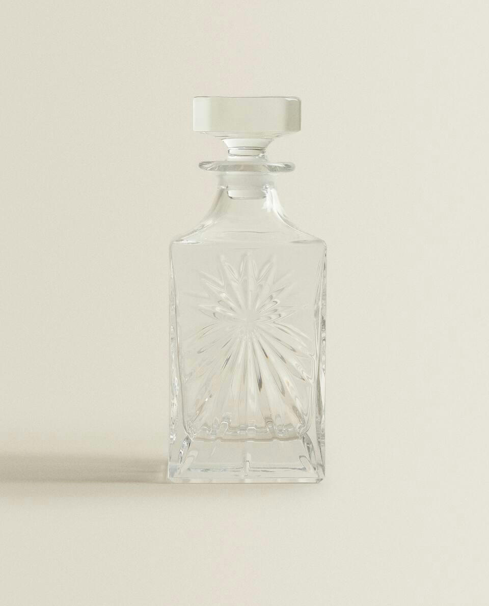 CRYSTALLINE BOTTLE WITH RAISED DESIGN
