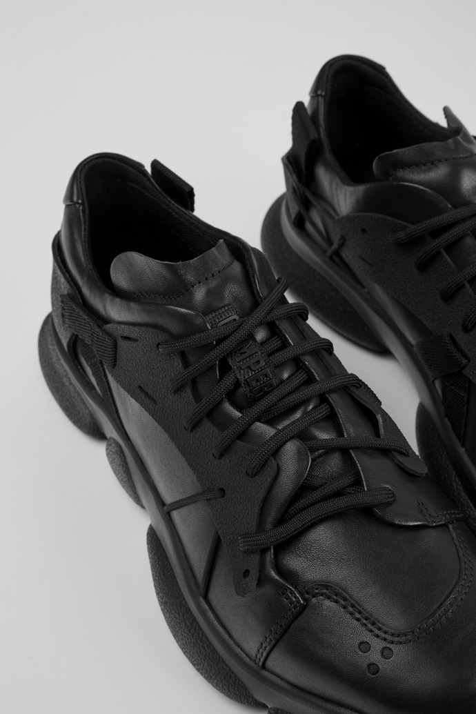 Sneakers negras de piel y tejido para mujer