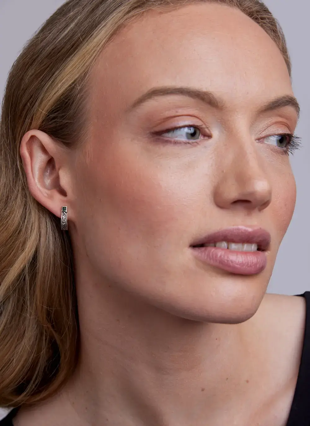 Celtic Huggie Earrings with Green Cubic Zirconia