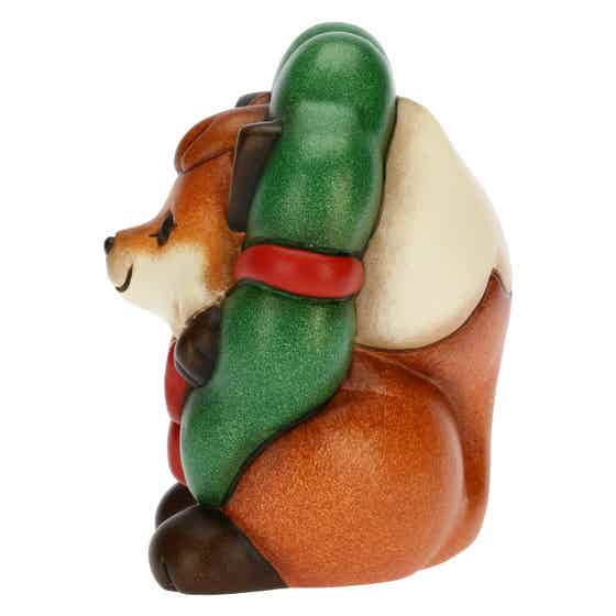 Grace the Fox with wreath and tin box