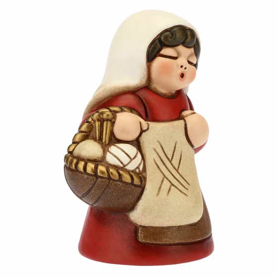 Woman knitting for Traditional Nativity Scene