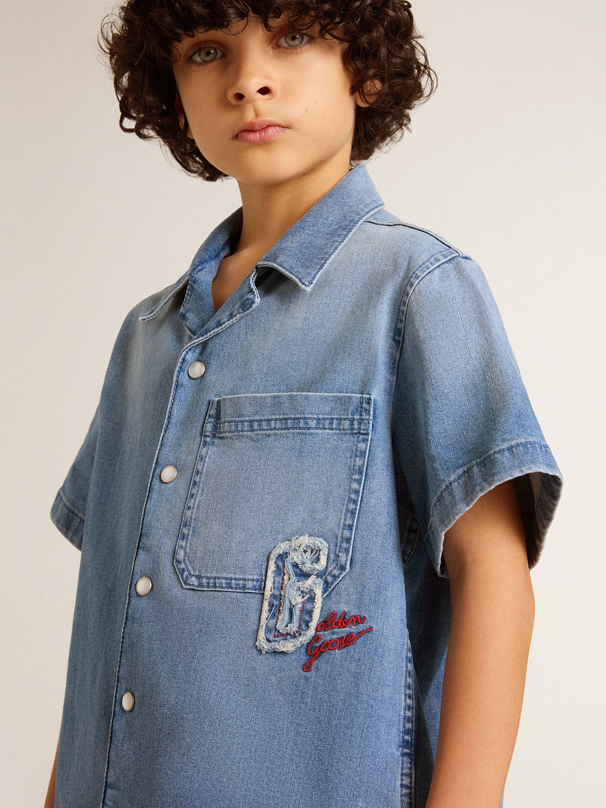 Kids' denim shorts with embroidery on the back