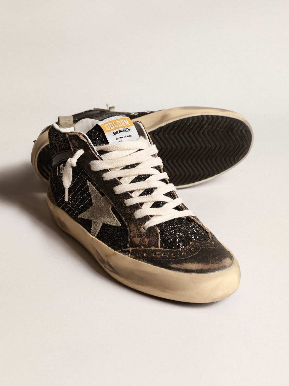 Women's Mid Star in black glitter with dove-gray suede star and heel tab