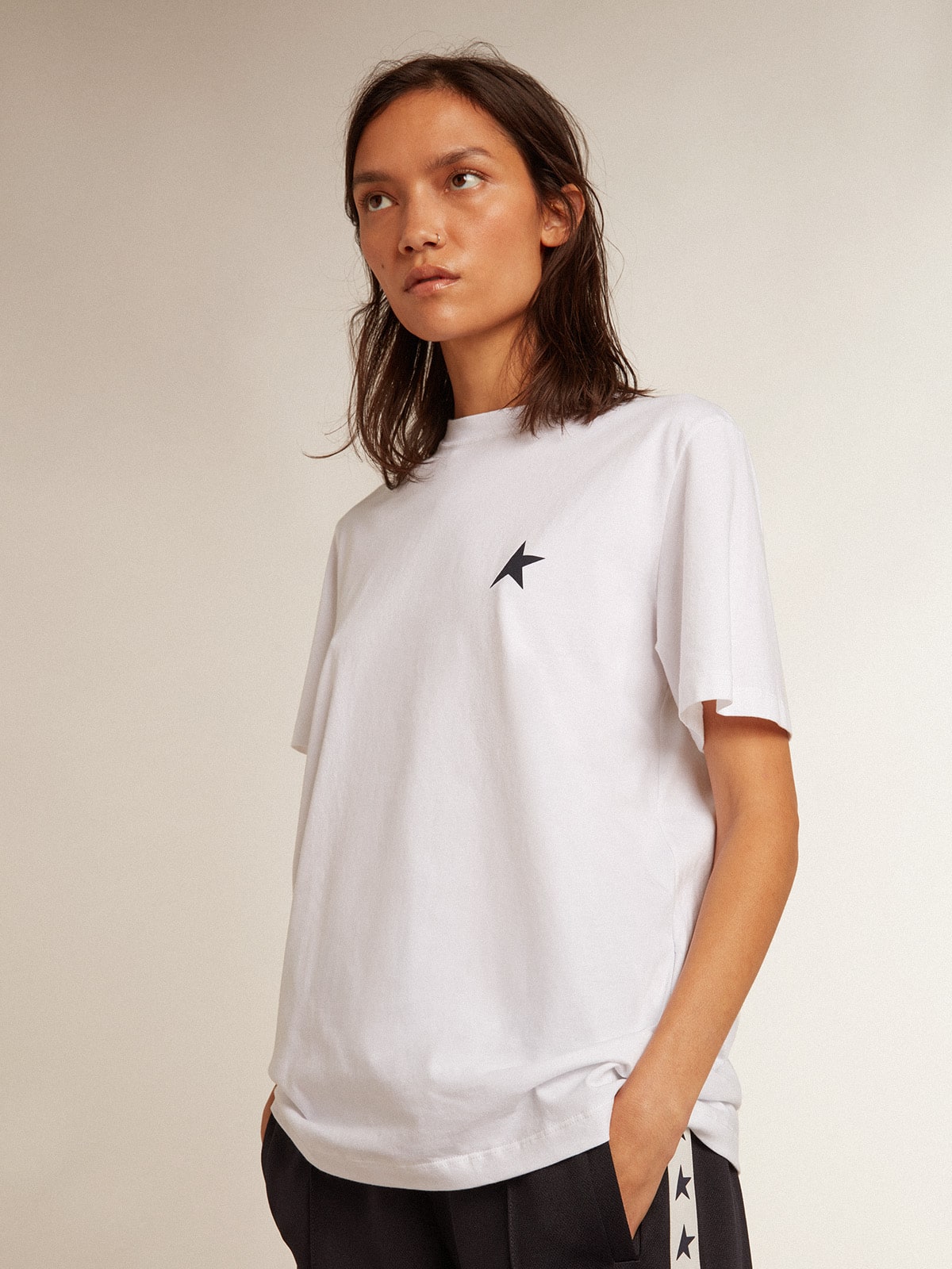 Women's white T-shirt with dark blue star on the front