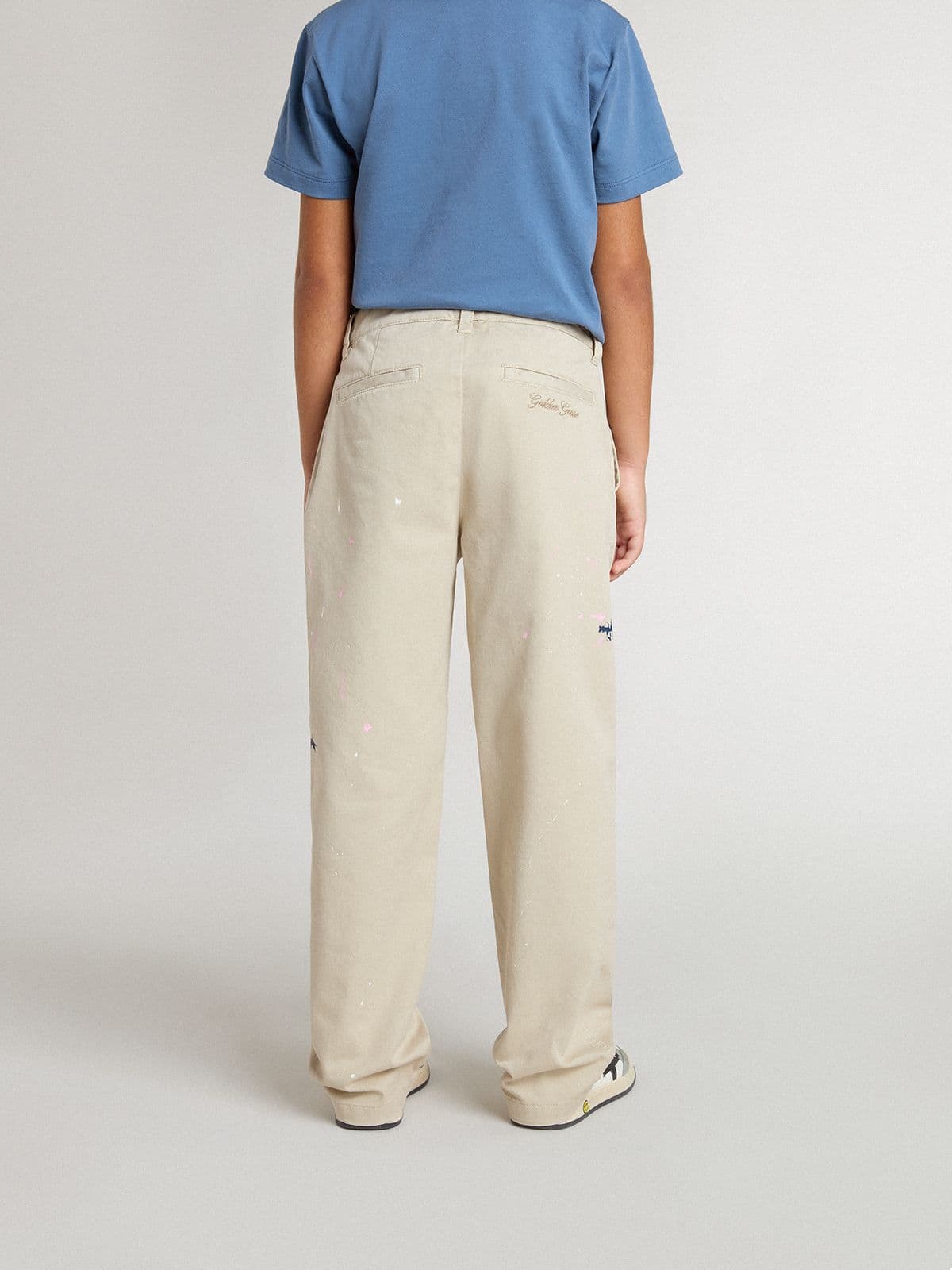Kids' beige chino pants with multicolor splashes