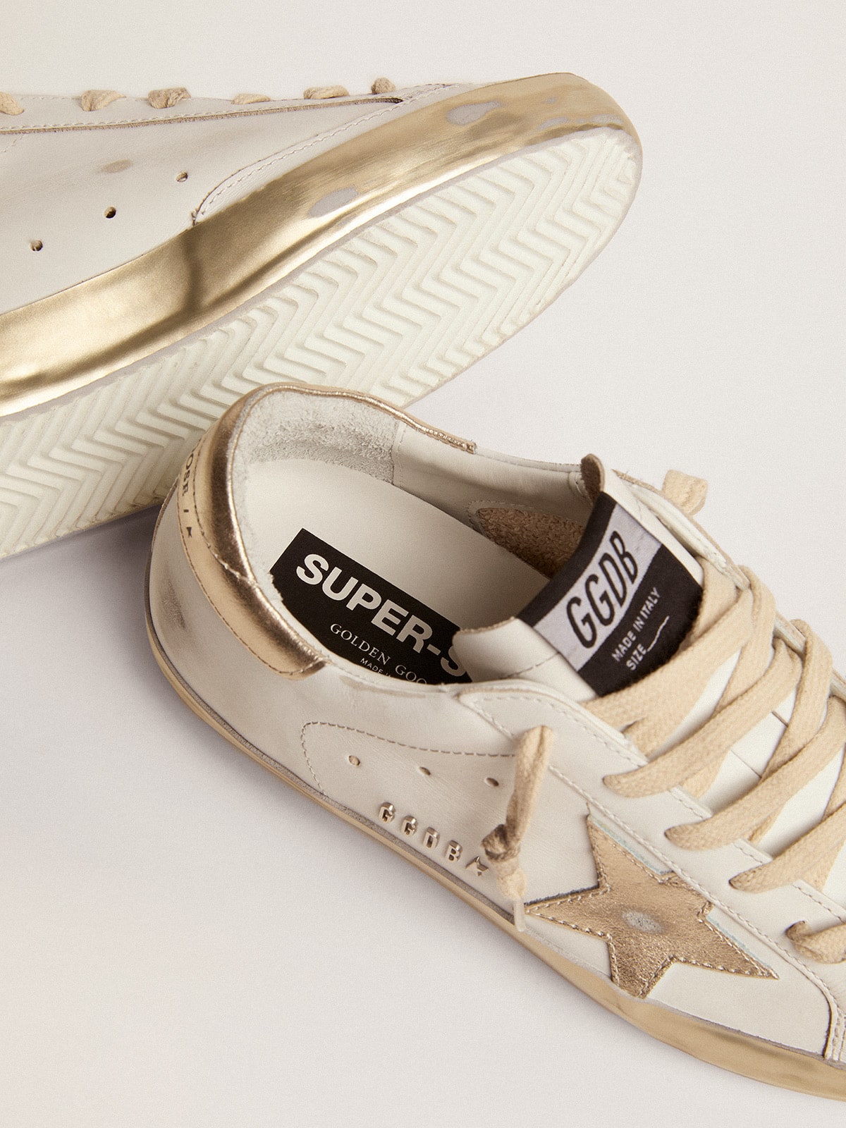 Women's Super-Star with gold sparkle foxing and metal stud lettering