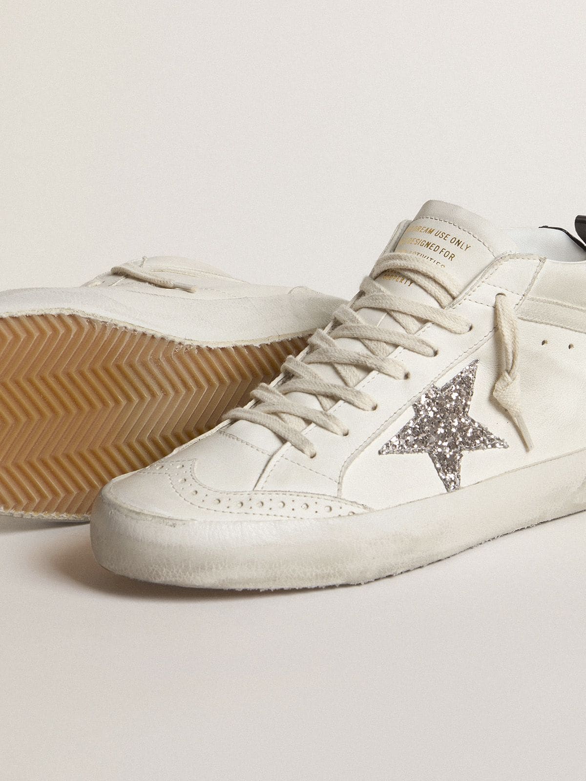 Mid Star with silver glitter star and black laminated heel tab