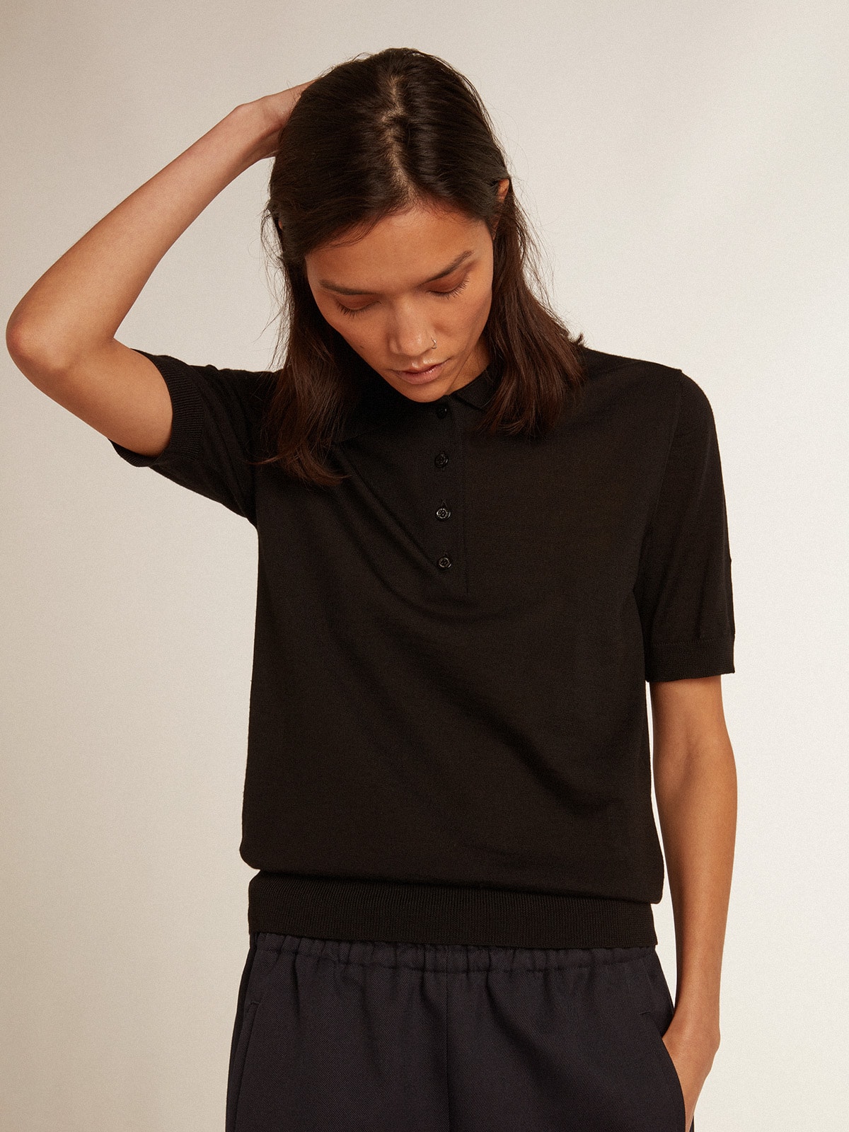 Women's polo shirt in black merino wool