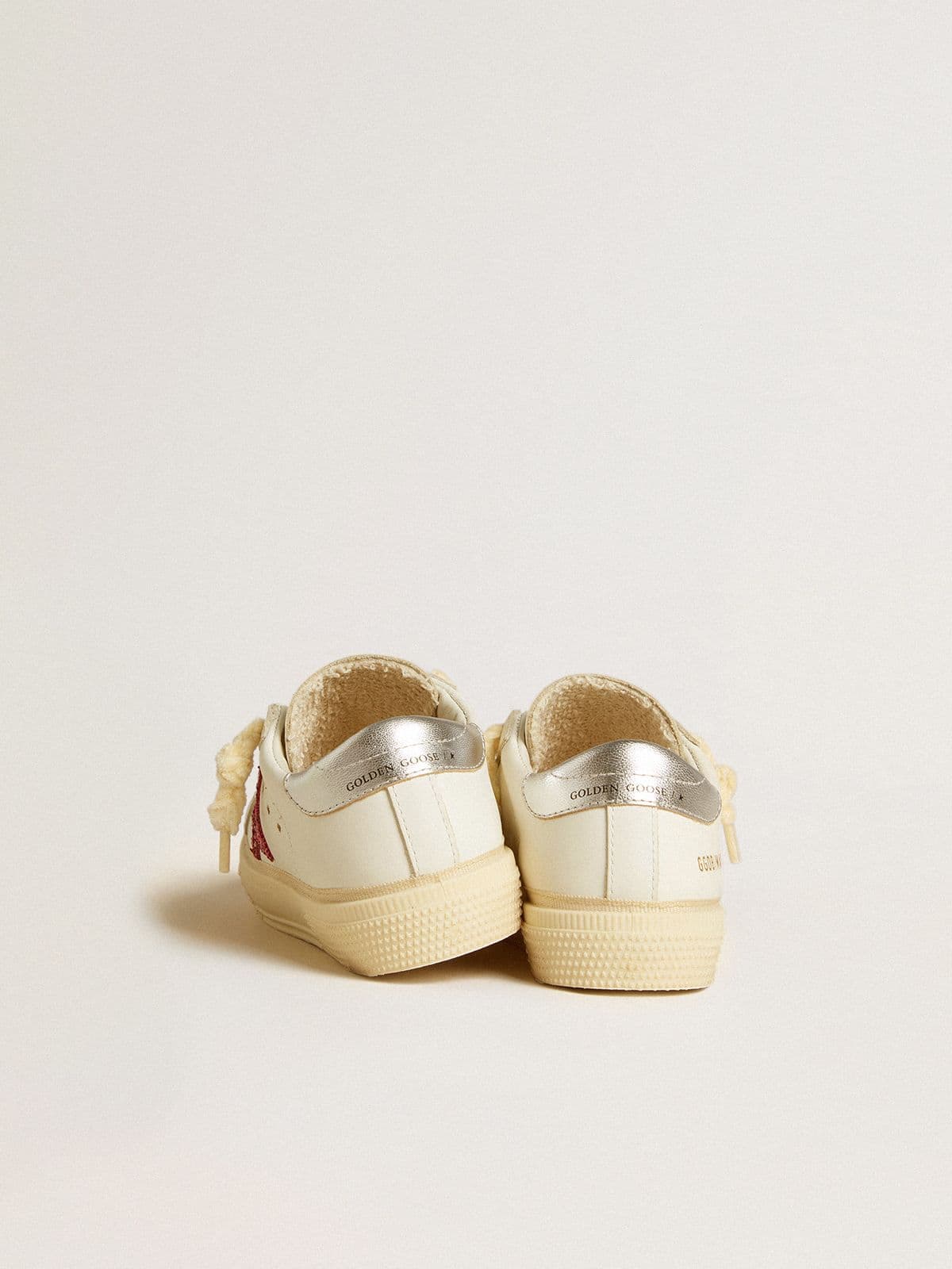 May Young with fuchsia glitter star and metallic leather heel tab